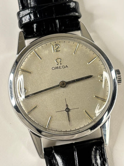 Collectible Omega Ref. 121.001-63 men’s 1962 vintage timekeeper featuring silver toned dial and refined Swiss craftsmanship