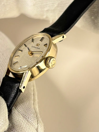 Side profile of Omega 1970s vintage ladies’ dress timekeeper 9ct gold watch signed crown