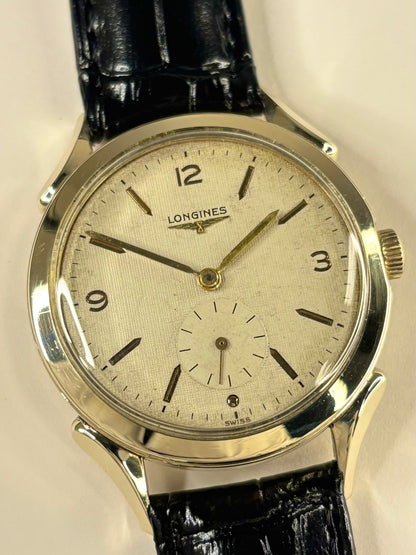 Close up of Longines 1954 vintage men’s watch textured dial gold filled case