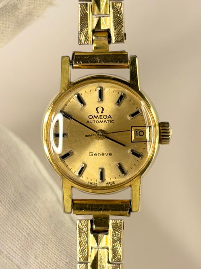 Premium luxury vintage Omega Genève ladies timepiece from the 1970s, model 562.016, featuring a gold-toned dial and gold-plated case, powered by a refined handmade mechanical timekeeper.