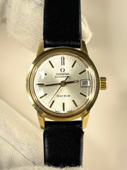 Close-up of Omega Geneve women’s automatic watch with gold-plated case and original dial