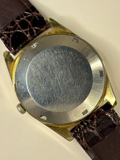 Omega Genève 1967 men’s vintage dress timekeeper gold plated caseback view with hallmark details