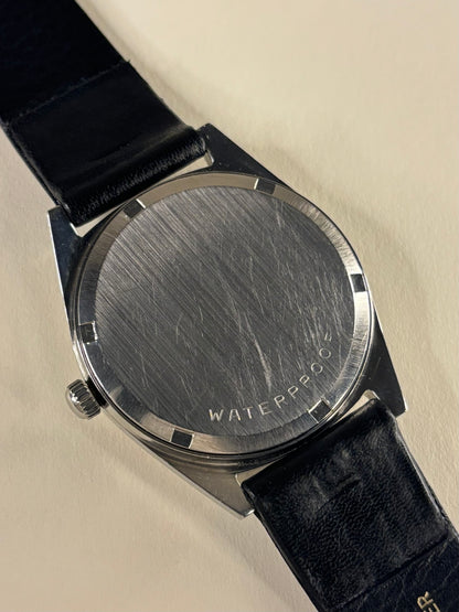 Omega Genève Ref. 135.041 stainless steel men’s vintage dress timekeeper caseback view with hallmark details