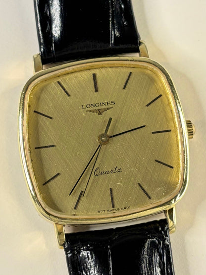 Close up of Longines 1980s men’s quartz watch gold dial vintage dress style