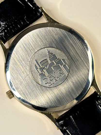 1980s Omega men’s quartz watch, gold-plated case, classic minimalist dial caseback view