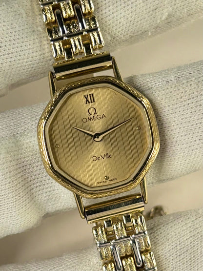 1980s Omega ladies quartz watch with gold-toned dial and gold-plated case, a classic Swiss vintage timepiece and elegant ladies timekeeper.