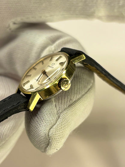 Side profile of Omega Genève ladies Ref. 511.346 timekeeper with slim gold plated 1971 case styling omega signed crown