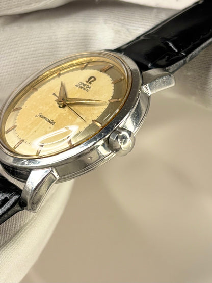 Side profile of Omega Seamaster Ref. 2857 men’s vintage 1963 timekeeper with slim stainless steel case styling omega signed crown