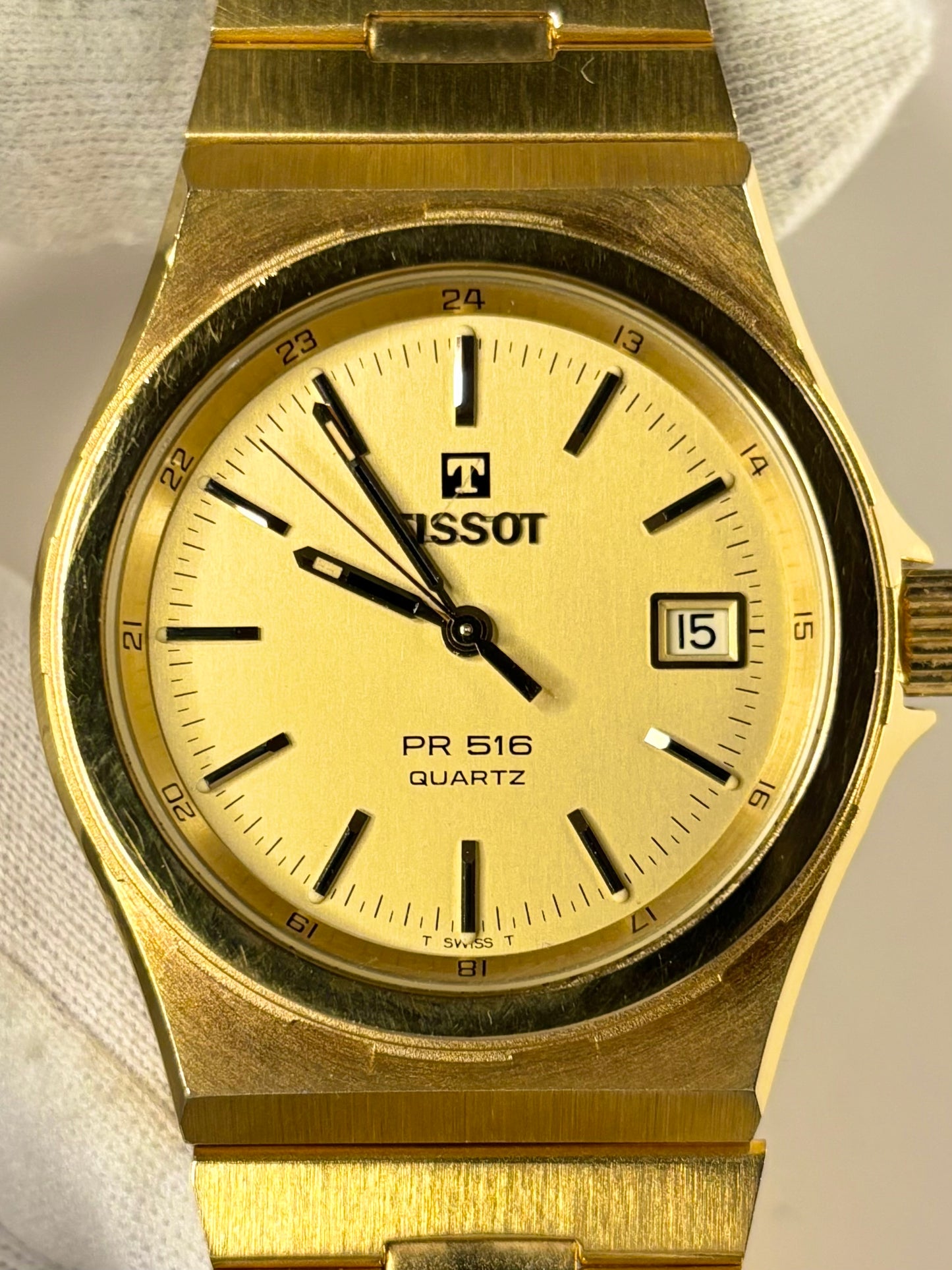 1982 Tissot PR516 men’s timepiece with gold-toned dial and gold-plated case, shown in excellent condition as a classic vintage timekeeper.