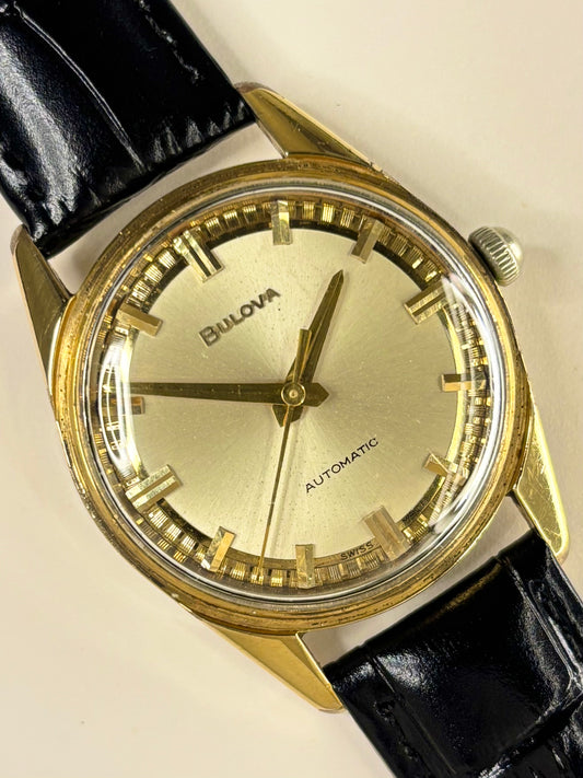 Premium luxury vintage Bulova automatic dress timepiece from the 1970s, featuring a classic dial and gold-plated case, a refined handmade mens timekeeper in excellent condition.
