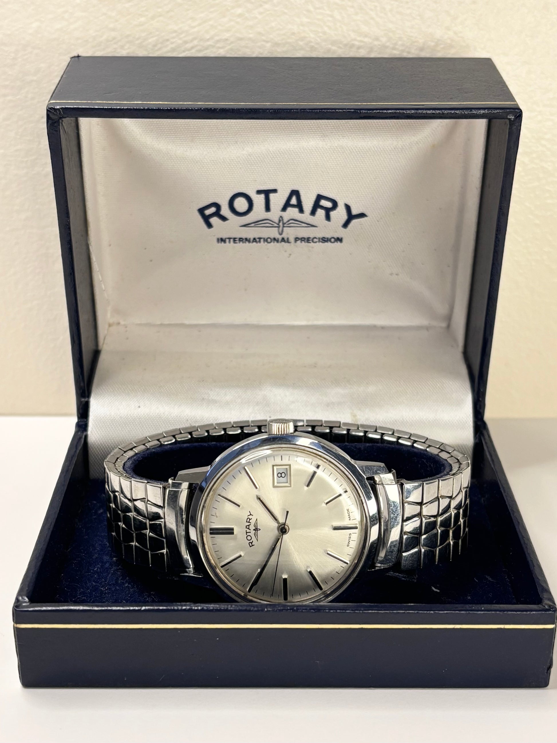 Collectible Rotary 1981 men’s vintage timekeeper featuring white sunburst dial, manual movement and original box