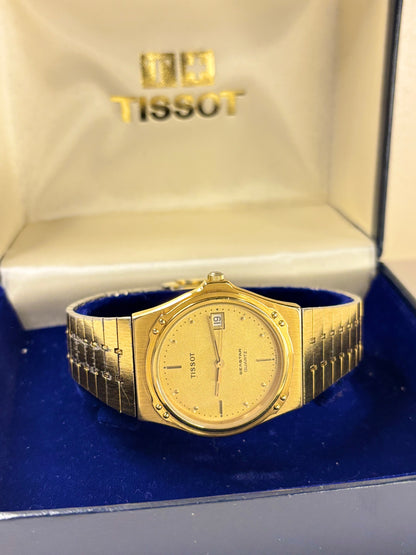 Tissot 1984 men’s dress timekeeper with gold plated case, gold toned dial, quartz movement and original box and papers
