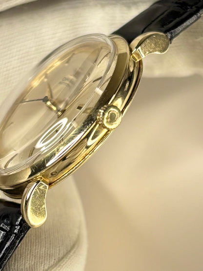 Side view of Omega ref. 2446 men’s 14ct gold automatic dress watch, 37mm case omega signed crown 