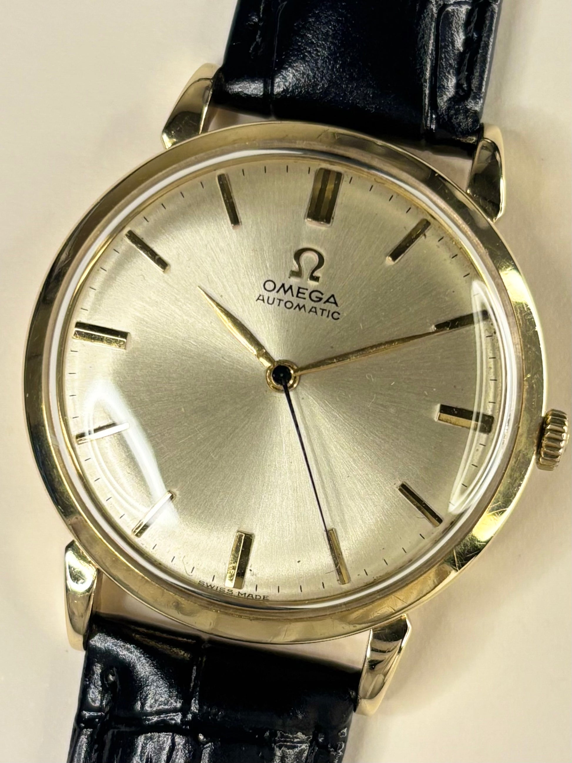 Omega vintage 14ct solid gold men’s watch with automatic movement and white sunburst dial