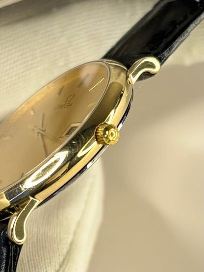 Side view of Omega 1990s men’s gold-plated quartz dress watch, calibre 1430, 34mm case omega signed crown