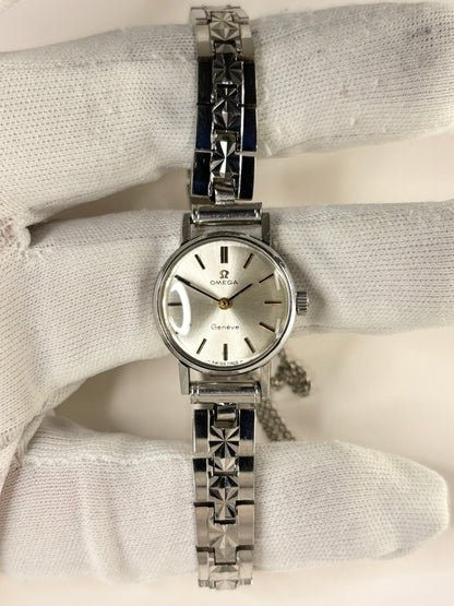 Collectible Omega ladies 1960s stainless steel timekeeper featuring white sunburst dial and vintage charm