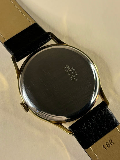 Caseback of J.W. Benson vintage 1964 gold plated 17 jewel manual wind watch