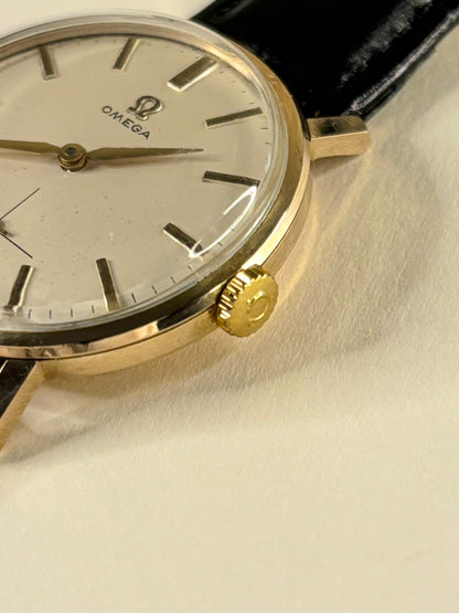 Side profile of Omega 1960s vintage men’s dress timekeeper solid gold signed crown 