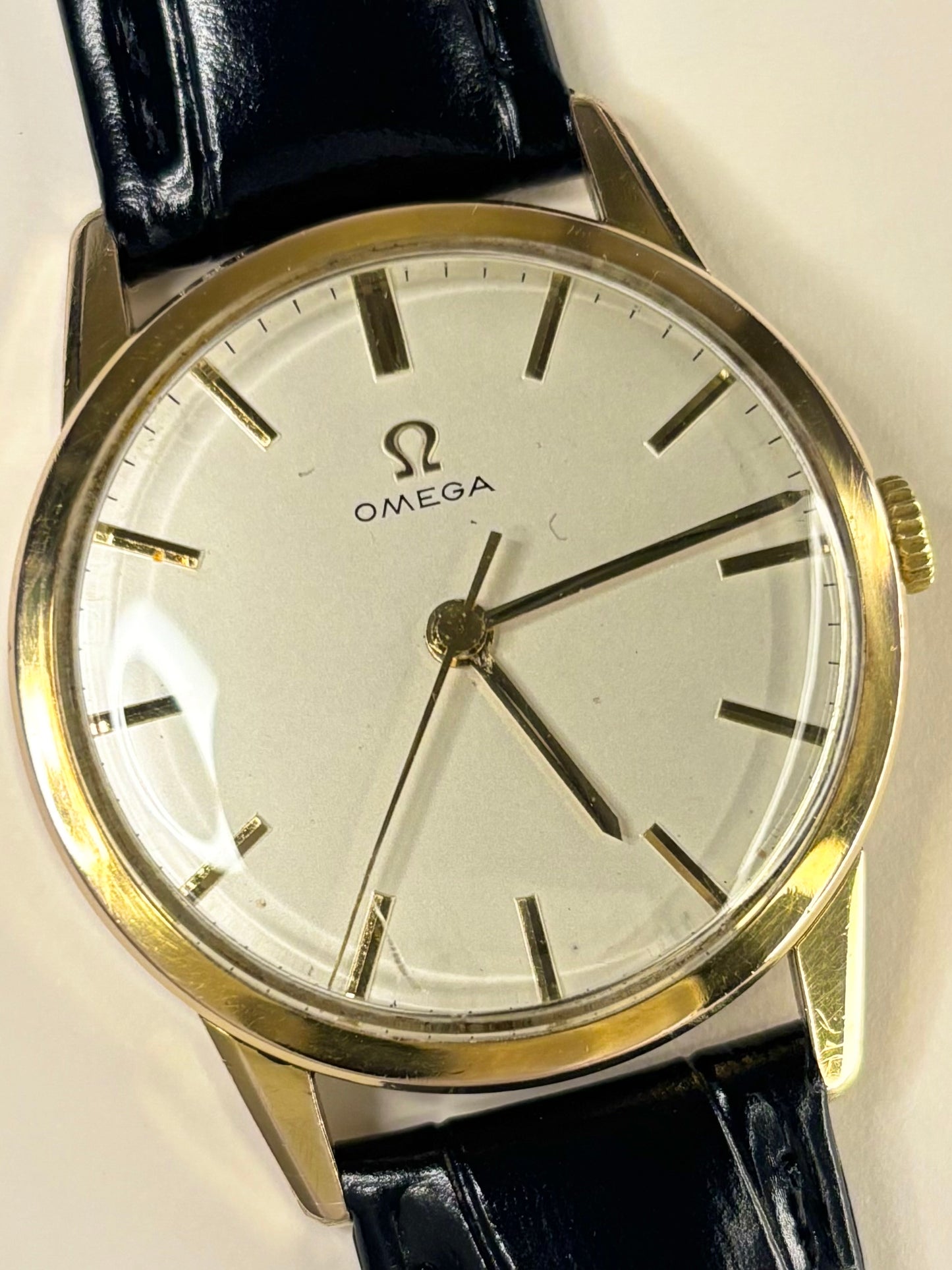 Close-up of Omega vintage manual watch with gold-plated case and original dial, ref. 14714-61