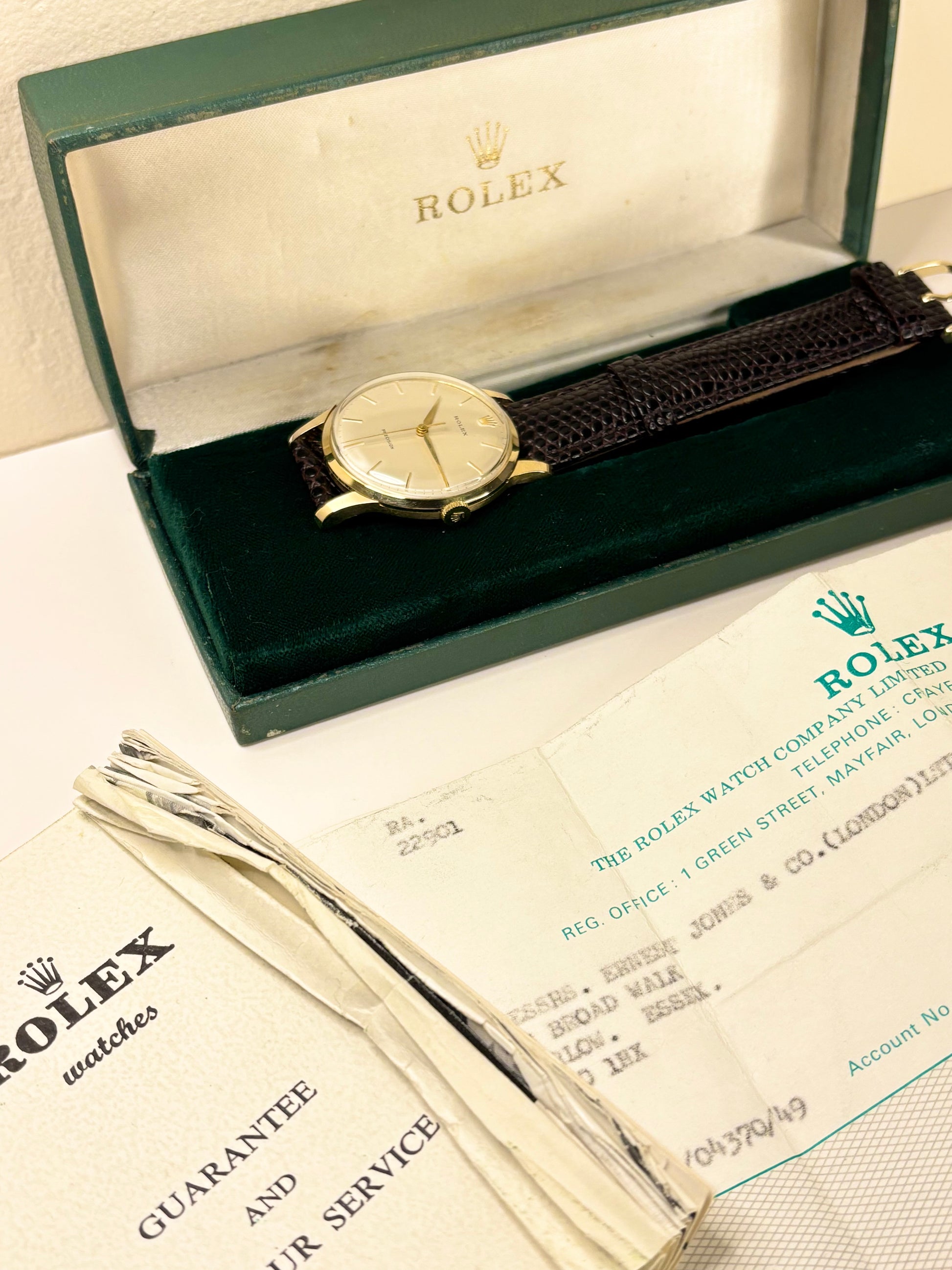 Detailed image of the 18ct Rolex Precision dress timepiece, with it's original box and papers