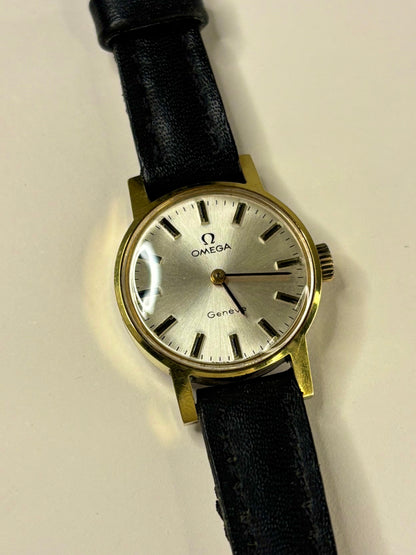Collectible Omega Genève ladies Ref. 511.346 timekeeper featuring white sunburst dial and 1970s charm