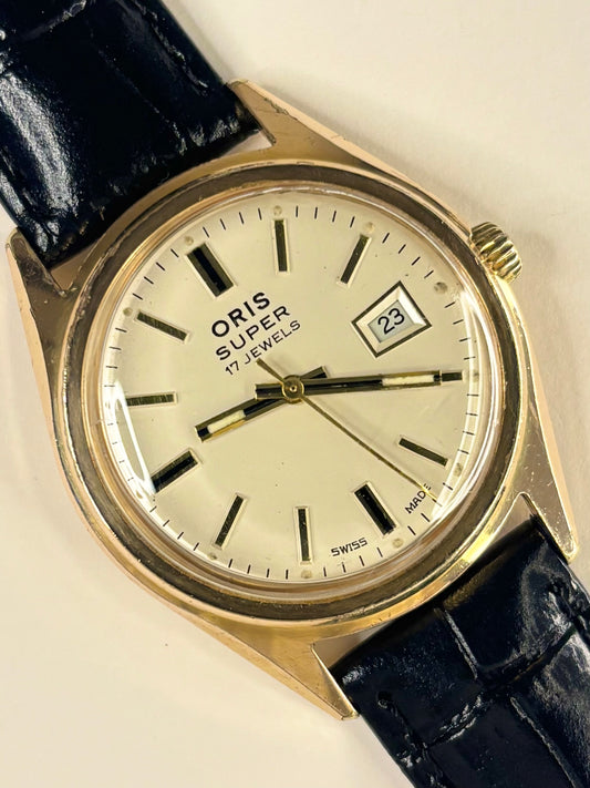 Vintage c.1973 Oris manual timepiece – men's gold-plated dress watch with white dial, in good condition with age-appropriate marks.