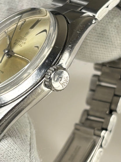 Side profile of Tudor Oyster Ref. 7934 men’s vintage 1963 timekeeper with slim stainless steel case styling Rolex signed crown