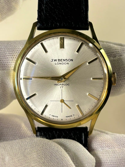 Close up of J.W. Benson 1964 men’s watch white sunburst dial 17 jewels