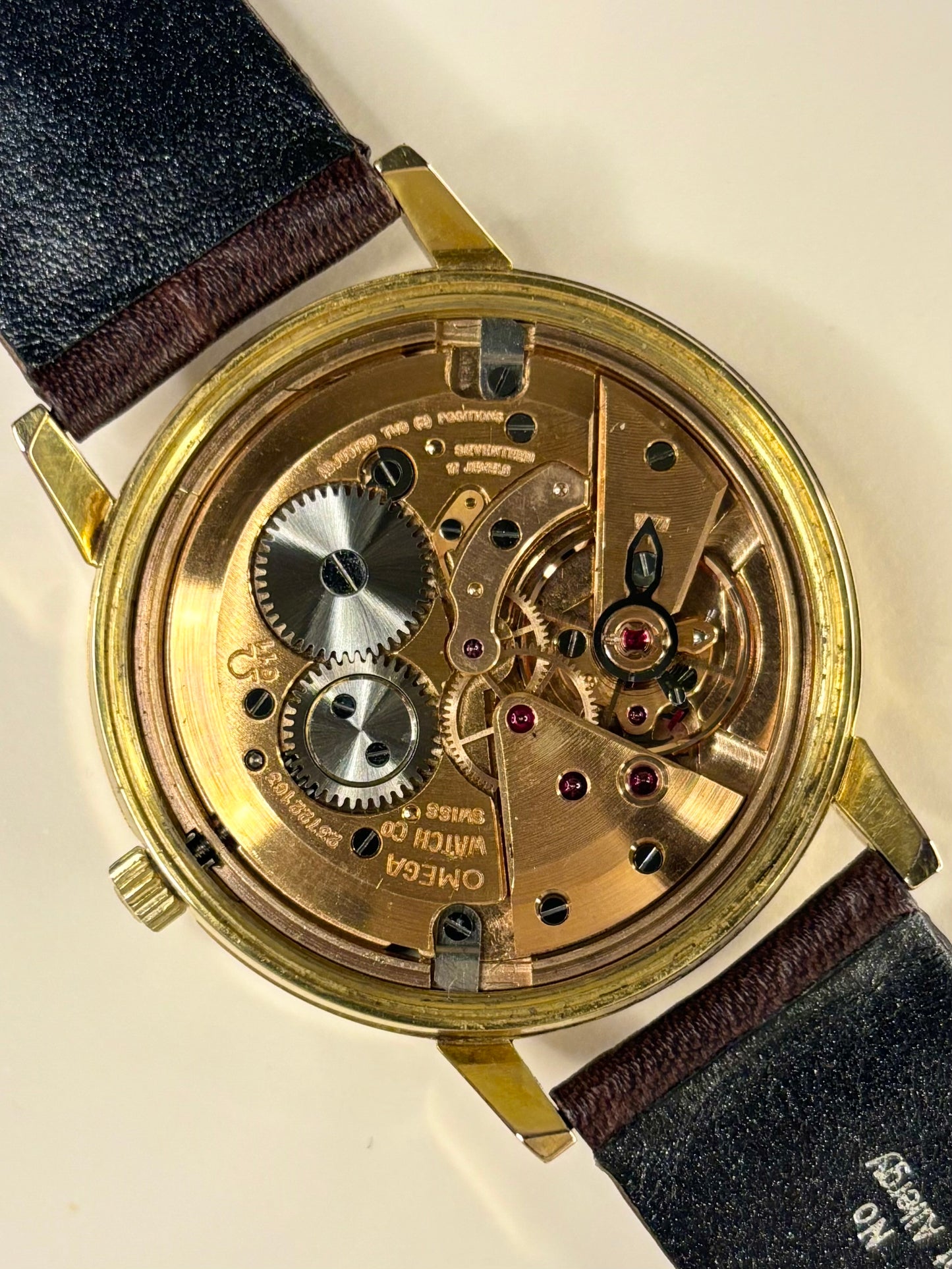 Premium luxury vintage Omega men’s dress watch with white sunburst dial, model 136.011 and Omega calibre 611 manual movement, an iconic handmade timepiece and dependable timekeeper