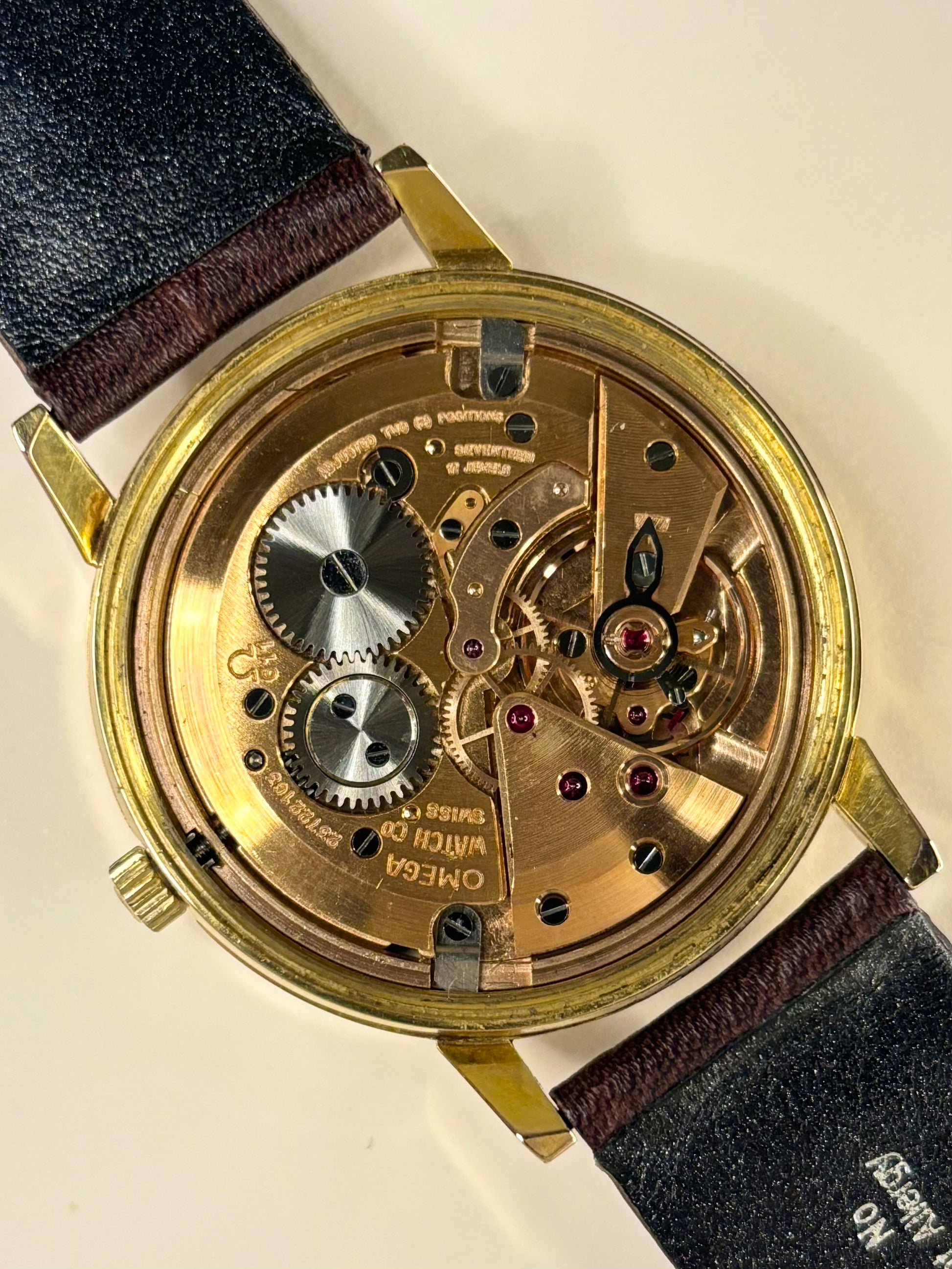 Premium luxury vintage Omega men’s dress watch with white sunburst dial, model 136.011 and Omega calibre 611 manual movement, an iconic handmade timepiece and dependable timekeeper