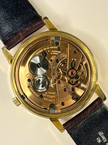 Premium luxury vintage Omega men’s dress watch with white sunburst dial, model 136.011 and Omega calibre 611 manual movement, an iconic handmade timepiece and dependable timekeeper