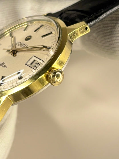 Side profile of Roamer Ref. 1972 men’s vintage dress timekeeper with slim 1972 gold plated case styling roamer signed crown