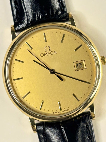 Close-up of Omega quartz movement watch ref. 396.1012, gold-plated case and gold dial