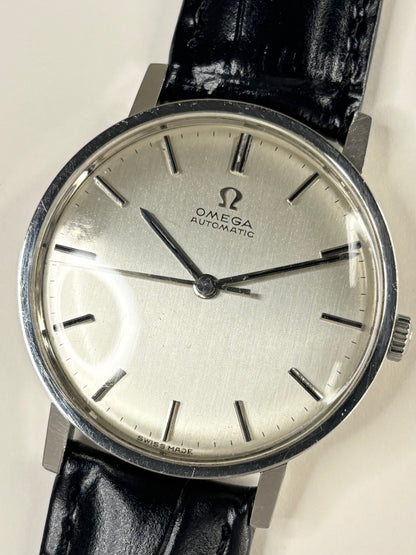 Collectible Omega Ref. 161.009 1965 men’s dress timekeeper featuring silver toned dial and vintage Swiss craftsmanship