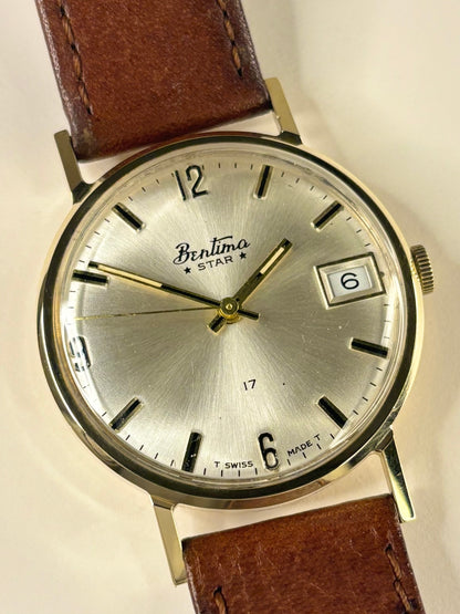 Close up of Bentima Star 1960's vintage men’s watch white sunburst dial