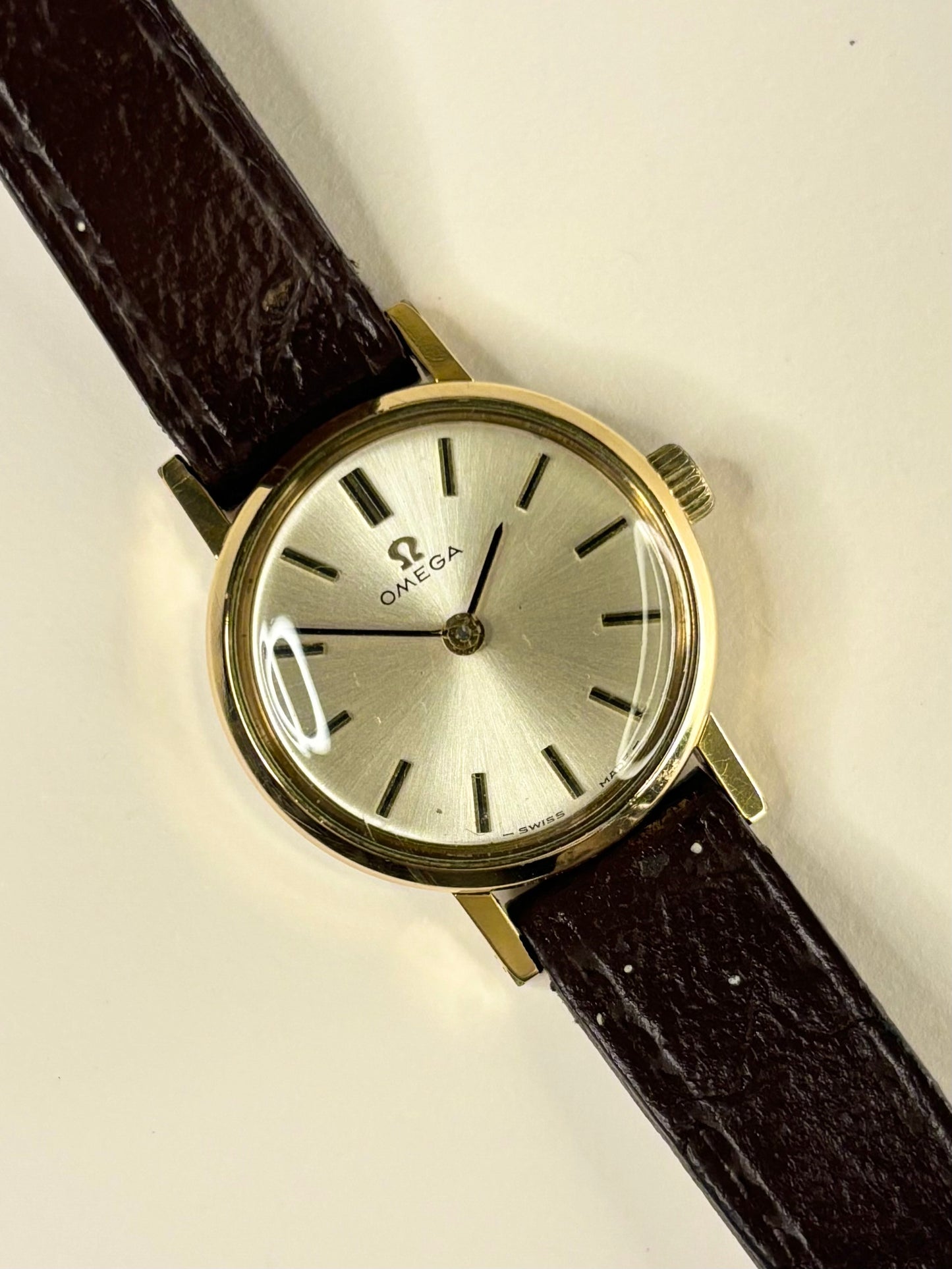 1969 Omega ladies timepiece, model 511.213 with manual movement 620, featuring a white sunburst dial and gold-plated case as a classic vintage timekeeper