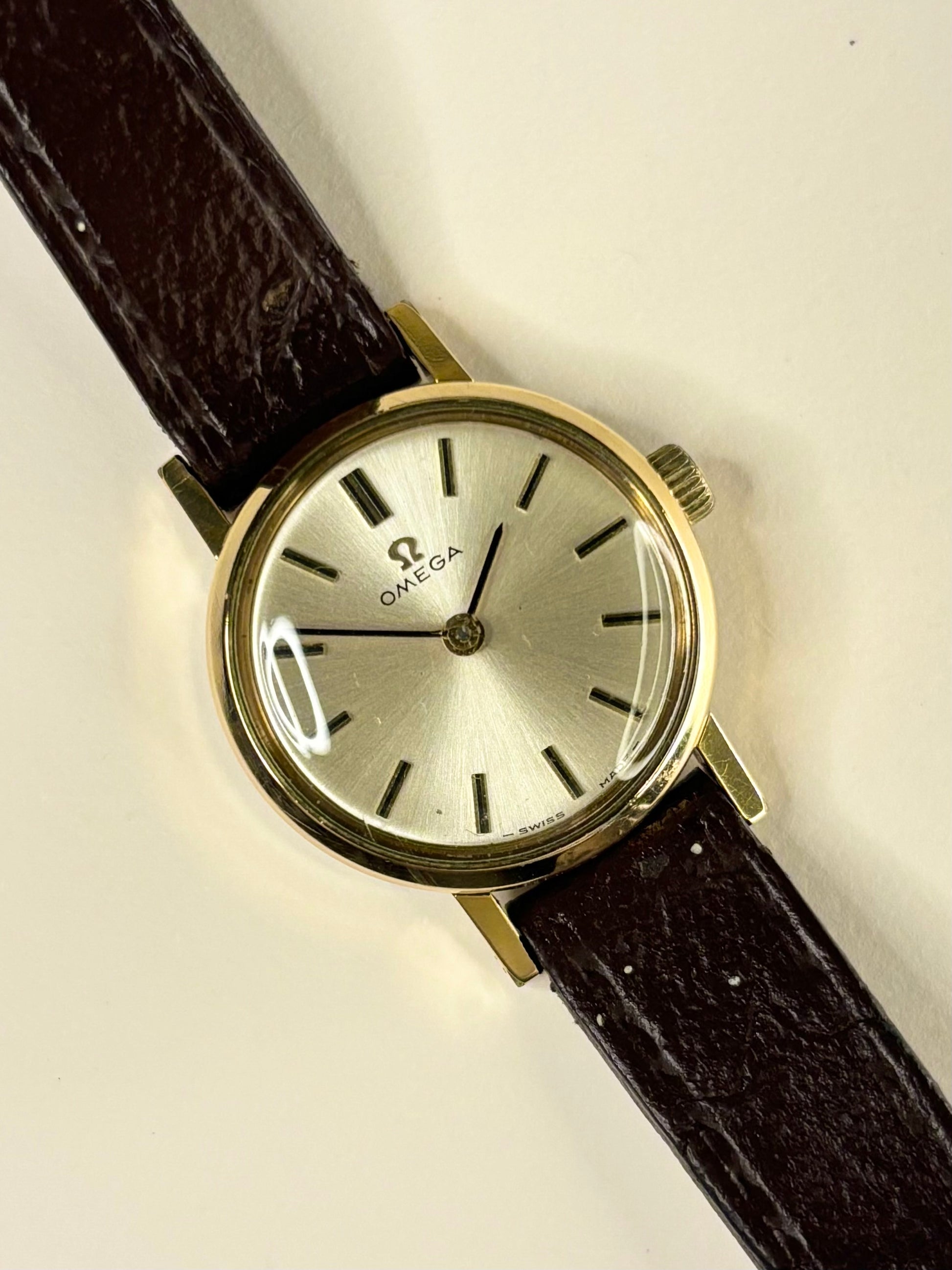 1969 Omega ladies timepiece, model 511.213 with manual movement 620, featuring a white sunburst dial and gold-plated case as a classic vintage timekeeper