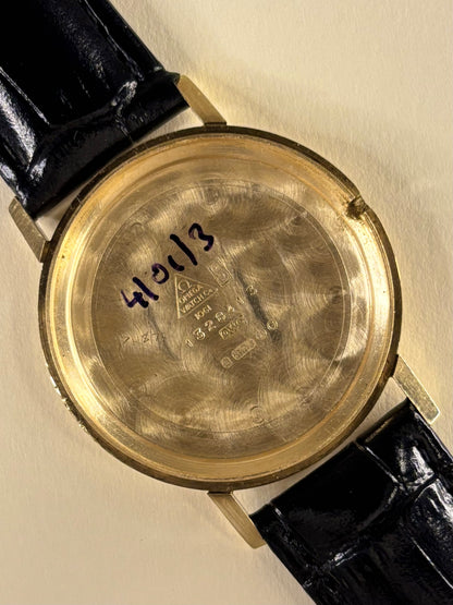 Omega Genève Ref. 132.8413 elegant 9ct gold timekeeper caseback view with hallmark details