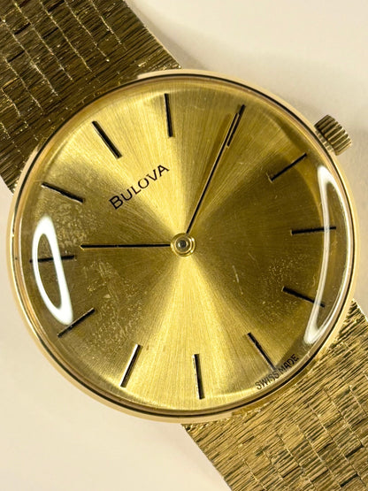 Vintage Bulova dress timepiece 1974 — manual wind mechanism, 34mm gold-plated case and gold dial
