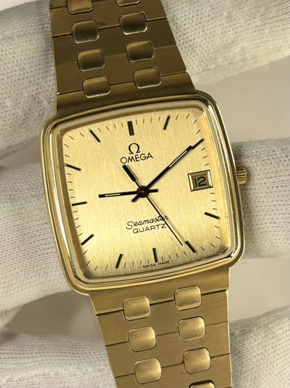 1970s Omega Seamaster quartz watch with gold-plated case and classic dial, a timeless Swiss vintage timepiece and refined mechanical timekeeper.