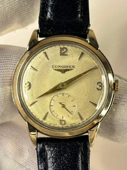 Close up of Longines 1952 men’s watch textured white dial vintage style