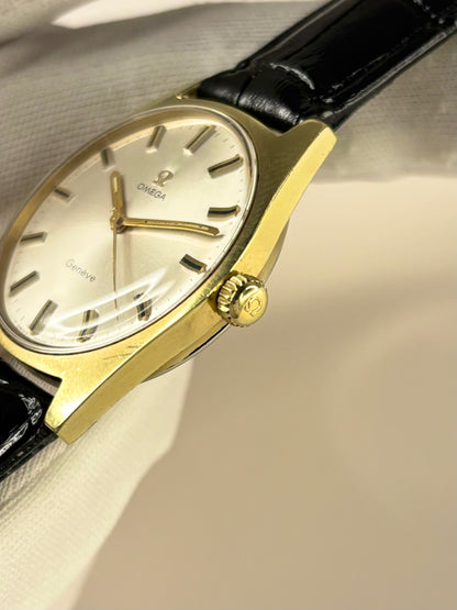 Side profile of Omega Genève Ref. 135.041 men’s vintage dress timekeeper with slim 1969 gold plated case styling omega signed crown