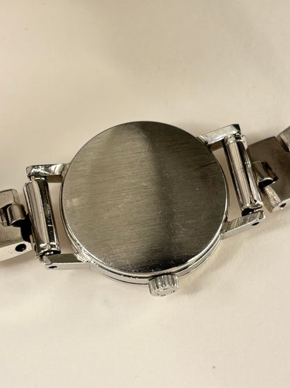 Omega ladies vintage 1960s stainless steel timekeeper caseback view with hallmark details