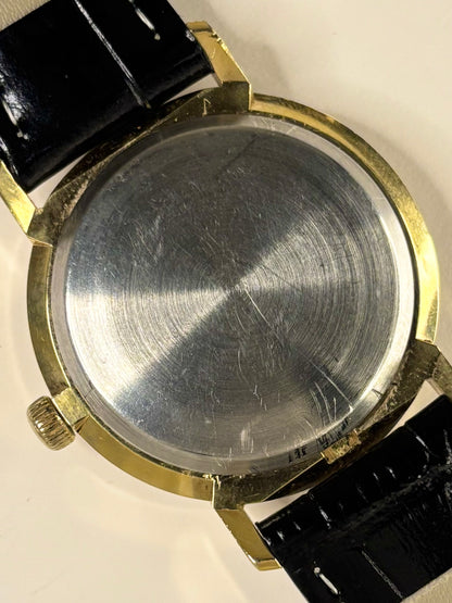 Rotary 1975 vintage dress timekeeper — 34mm gold-plated case, automatic movement with polished caseback and white sunburst dial