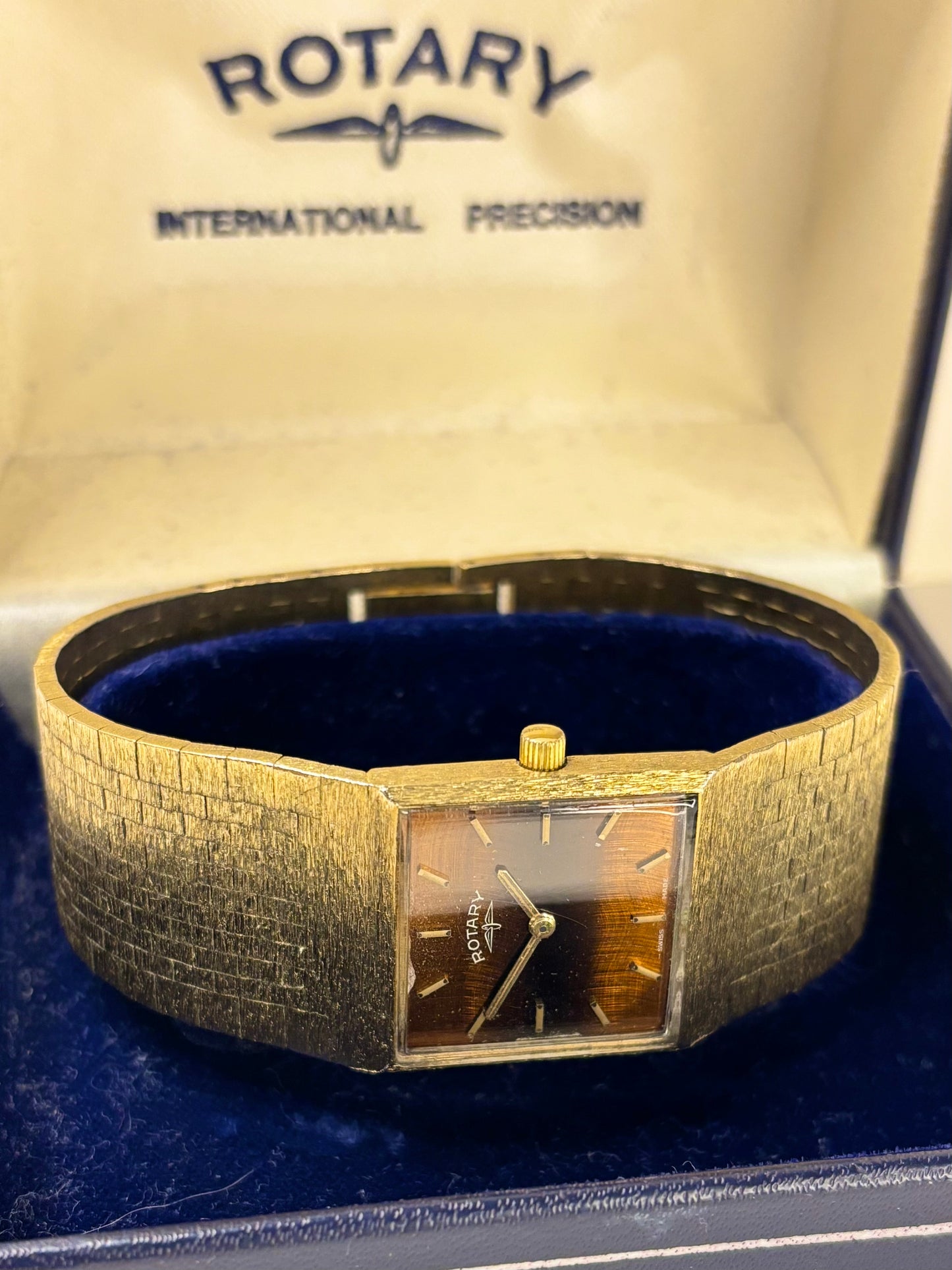 1970s Rotary dress watch timepiece featuring a rare tiger’s eye dial and gold-plated case, shown in great condition as a striking vintage timekeeper