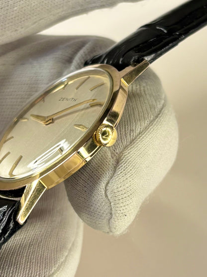 Side profile of Zenith 1965 men’s vintage dress timekeeper with slim gold filled case styling Zenith signed crown