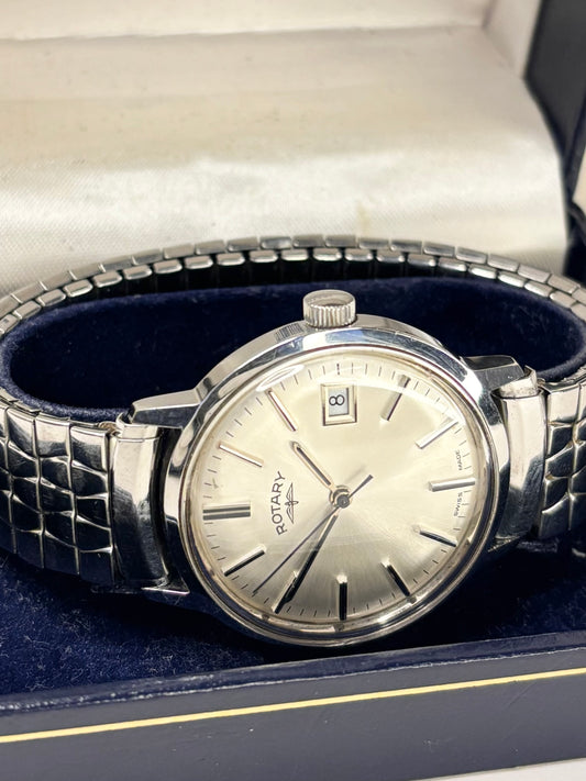 Rotary 1981 men’s dress timekeeper with stainless steel case, white sunburst dial, manual movement and original box and papers