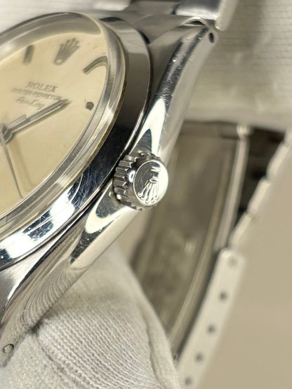 Side view of Rolex Oyster-Perpetual 1960s men’s watch, stainless steel case, automatic cal. 1500 Rolex signed crown 