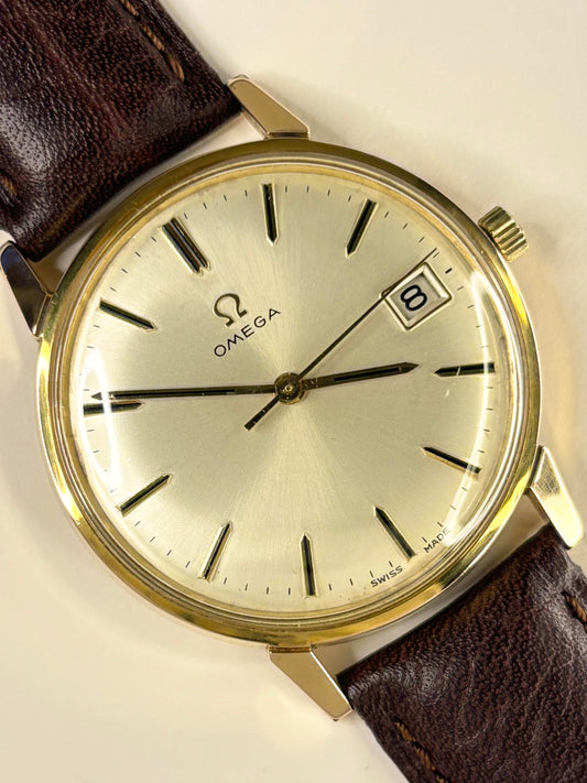 Premium vintage Omega dress timepiece with gold-plated case and crisp white sunburst dial, model number 136.011 fitted with Omega calibre 611 manual movement, a refined handmade luxury timekeeper