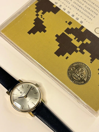 Close-up of Omega ladies vintage watch with sunburst dial and gold-plated case, ref. 511.215